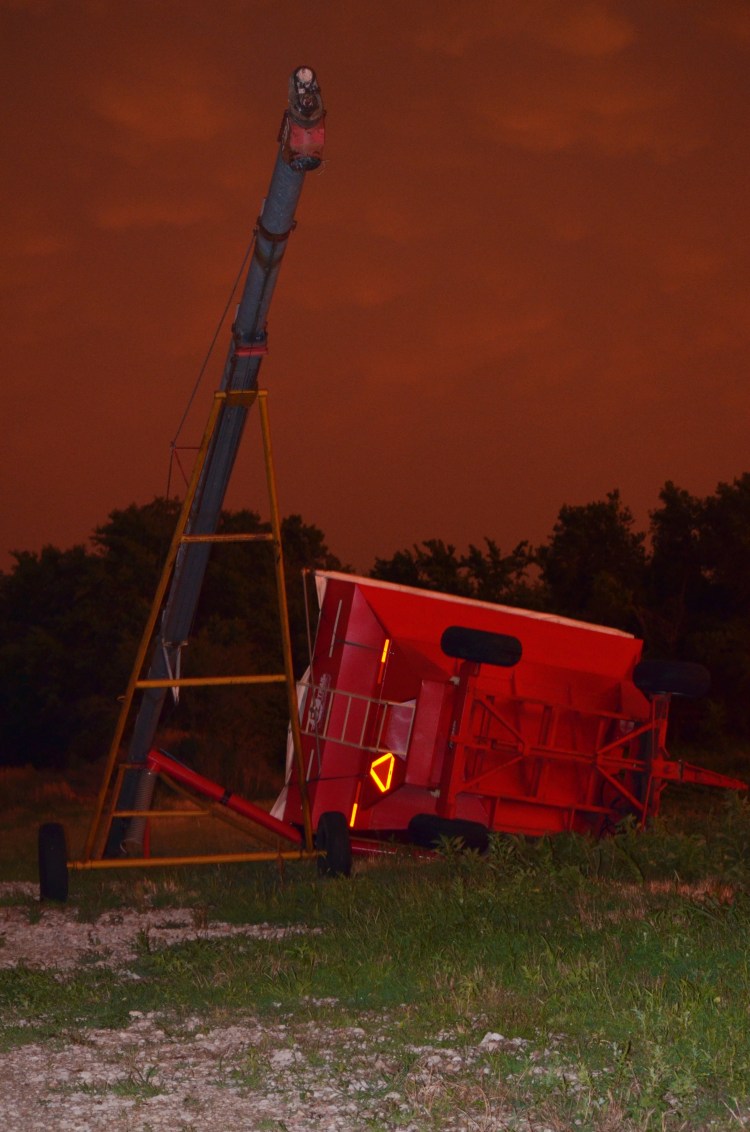 Flipped gravity wagon tangled with one of our augers.